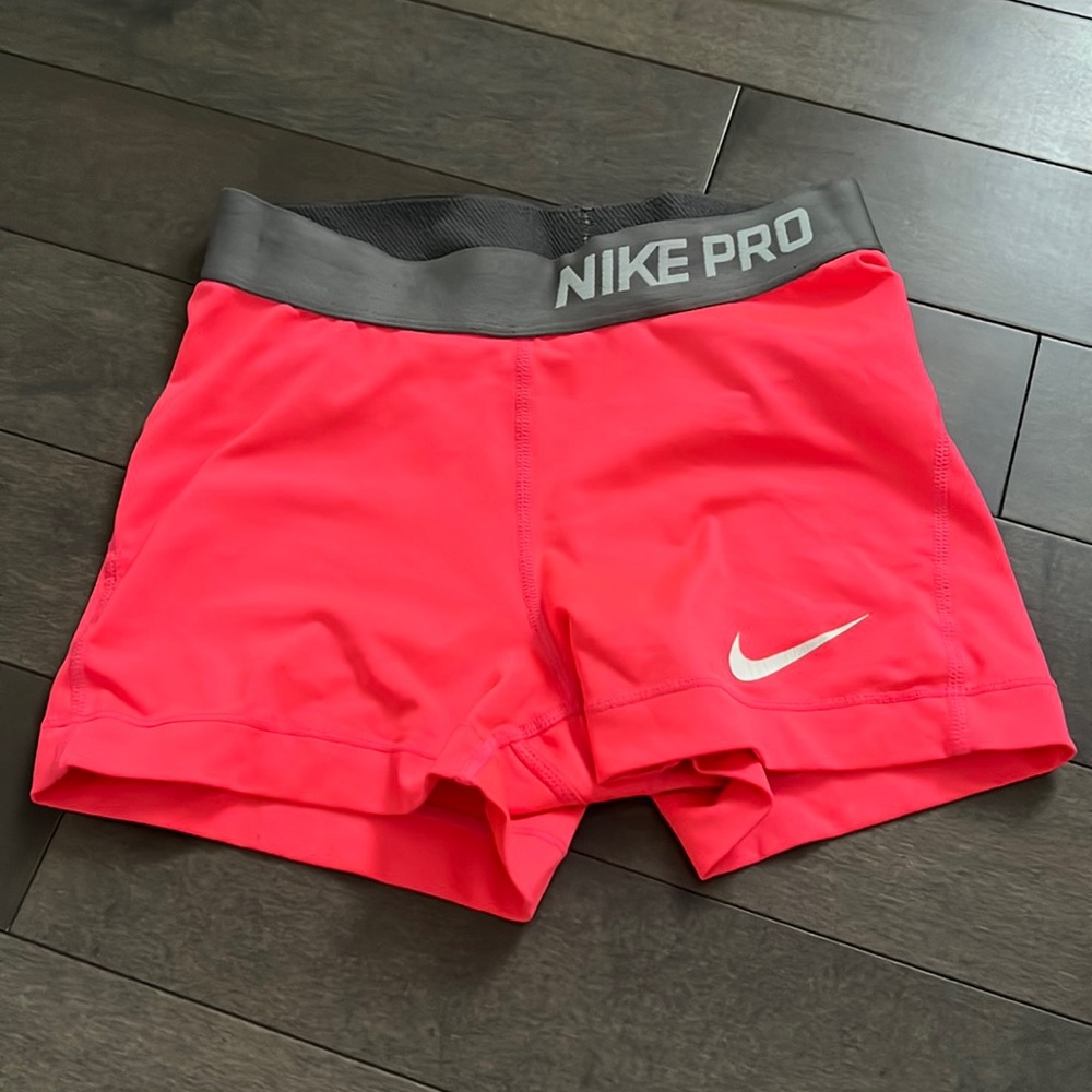 Neon pink Nike pros